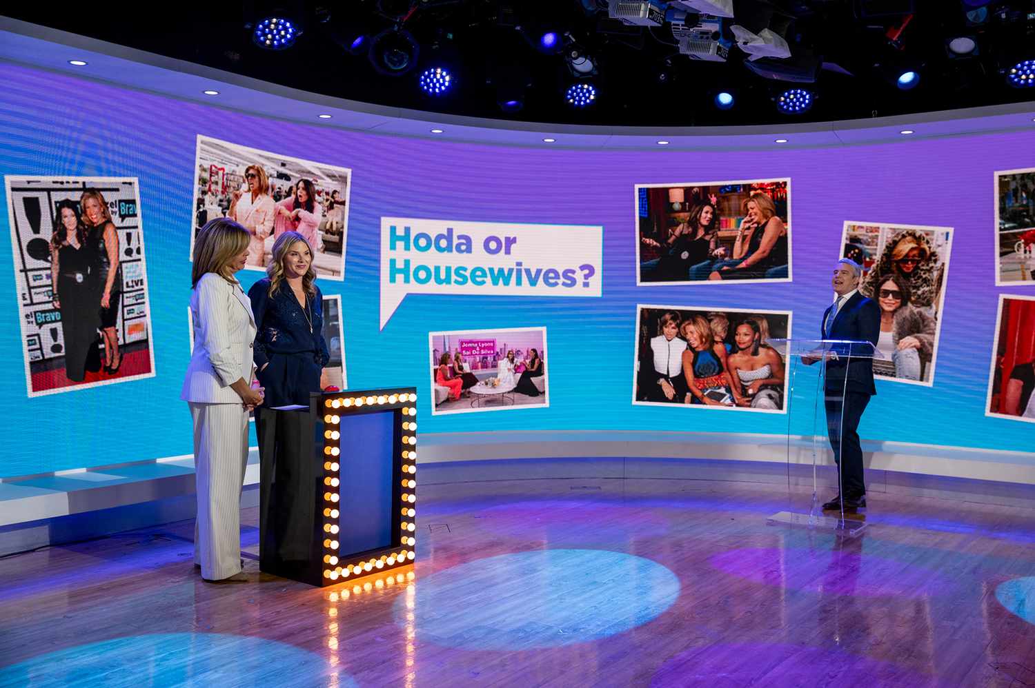 Studio set met drie personen die praten over het onderwerp 'Hoda of Housewives?' op een groot scherm